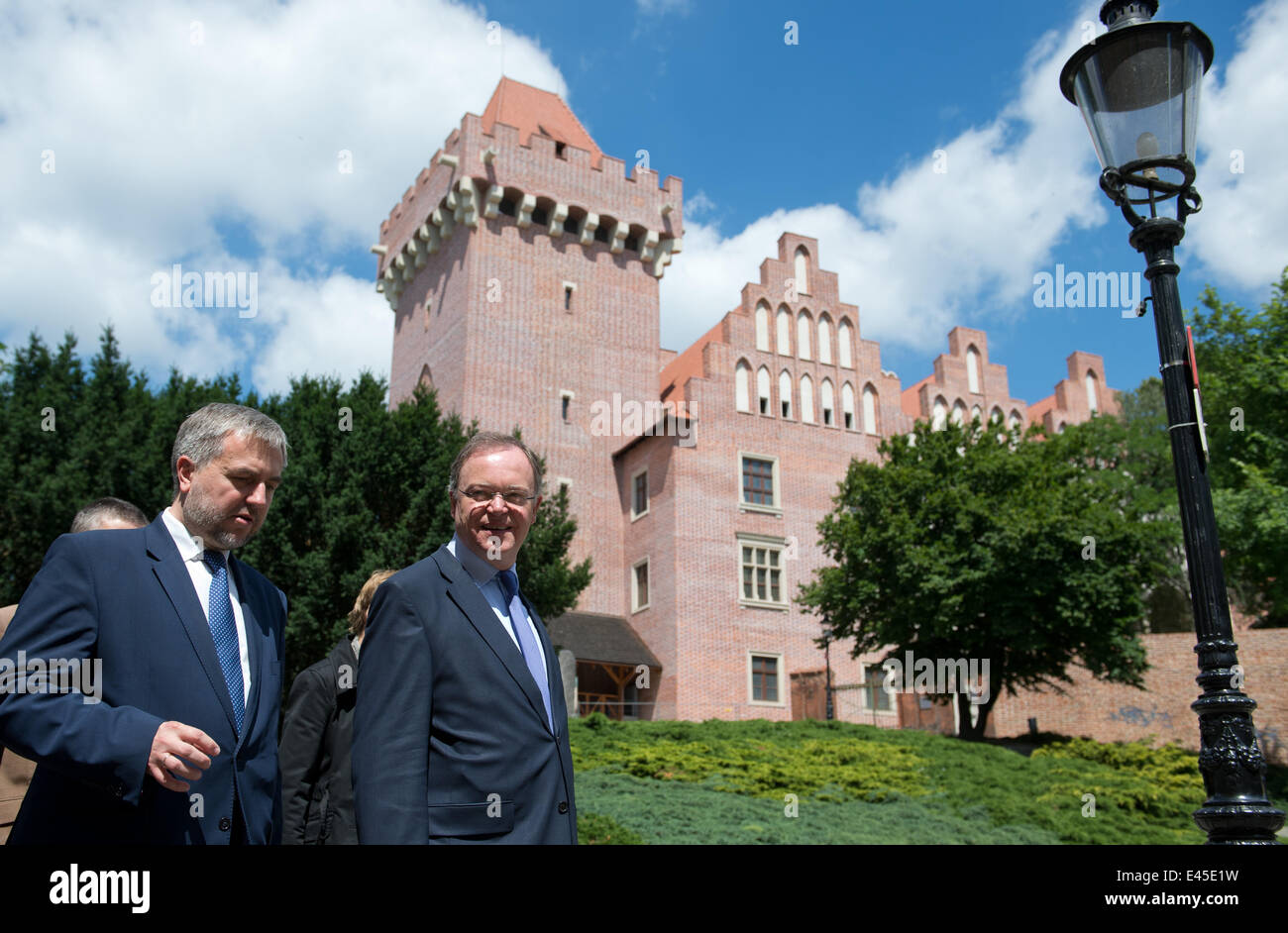 Poznan, Poland. 3rd July, 2014. President of the German Federal Council and Premier of Lower Saxony Stephan Weil (L) poses with Greater Poland Voivode Marek Wozniak in the historic inner city in Poznan, Poland, 03 July 2014. Weil is attending political talks in Warsaw in his role as Federal Council President. Photo: JOCHEN LUEBKE/dpa/Alamy Live News Stock Photo