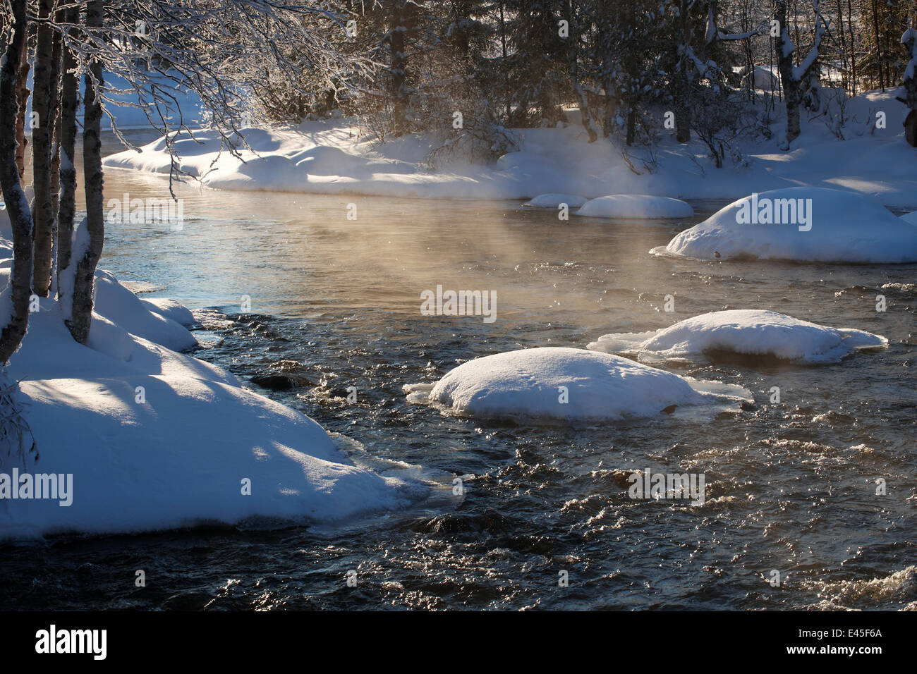 Kikajoki River in winter, with light mist over the water, Finland, February 2009 Stock Photo