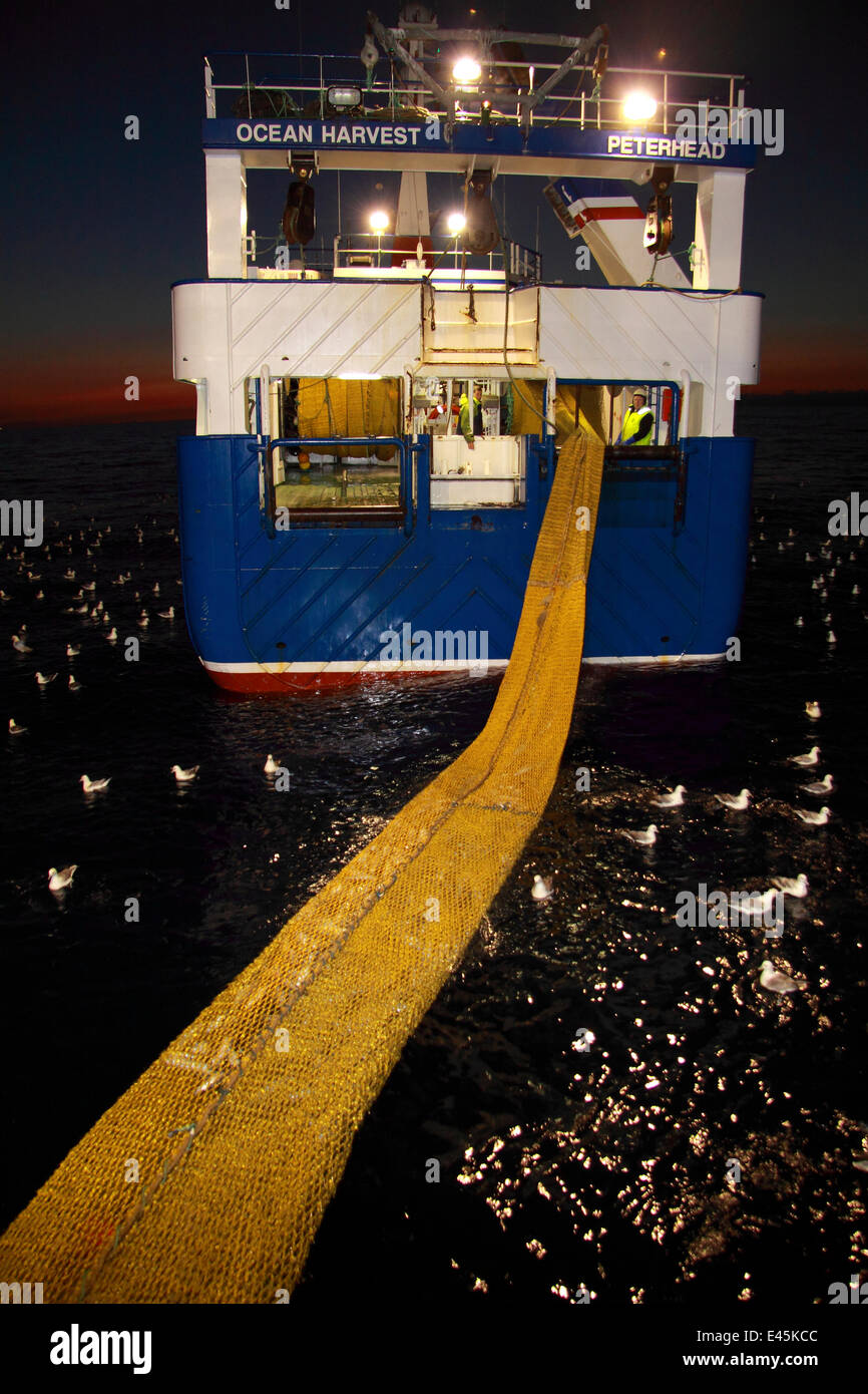 Trawler Ocean Harvest hauling net onboard. North Sea, June 2010. Property released. Stock Photo