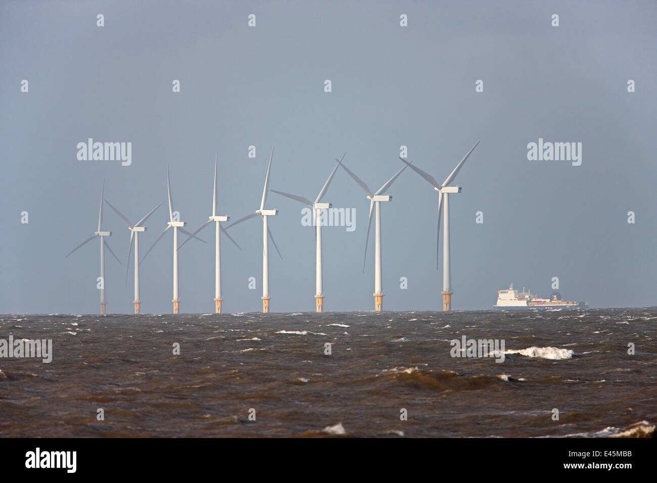 Several off-shore wind turbines in Liverpool Bay, UK, November. Stock Photo