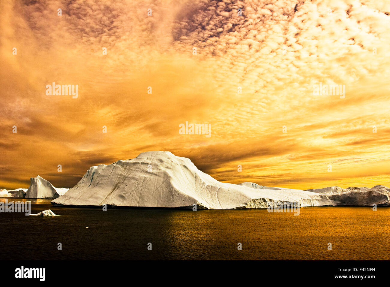 Sunset over iceberg. Jakobshavn, Ilulissat, Kangia, Icefjord, Greenland ...