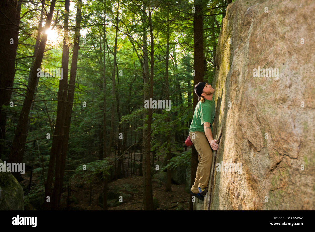 Man bouldering in The Boulders" section of Pawtuckaway State Park, New