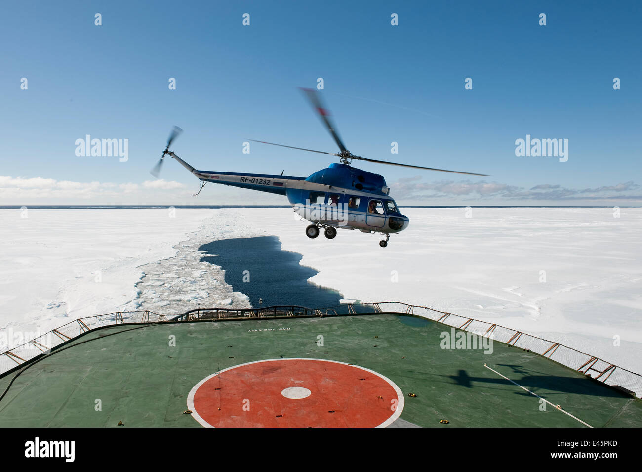 Helicopter landing on the deck of the Russian ice breaker ship, Kapitan Khlebnikov, Ross Sea, Antarctica, November 2008 Stock Photo