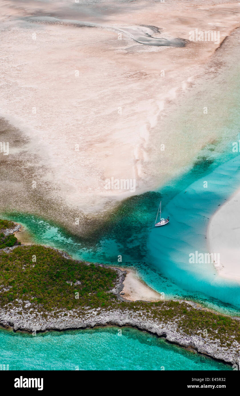 Aerial view of the Exumas, with a lone yacht. Bahamas, Caribbean, June