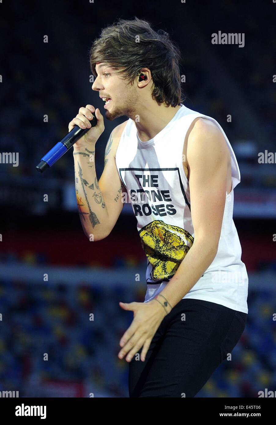 Duesseldorf, Germany. 02nd July, 2014. Louis William Tomlinson of  British-Irish band One Direction performs on stage during a concert at the  Esprit Arena in Duesseldorf, Germany, 02 July 2014. It is the, image size:903x1390