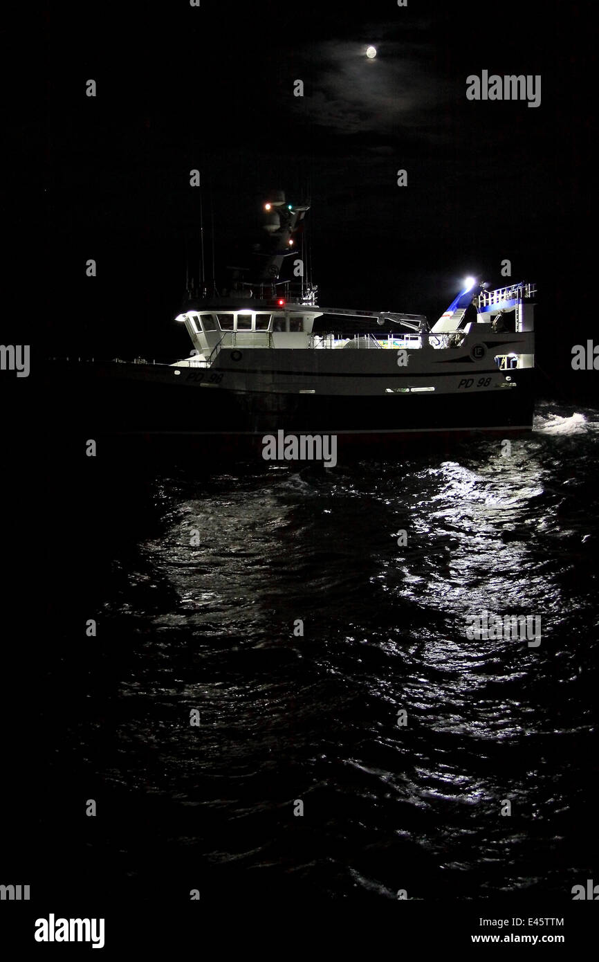 Fishing vessel 'Harvester' trawling on the North Sea at night, September 2010. Property released. Stock Photo