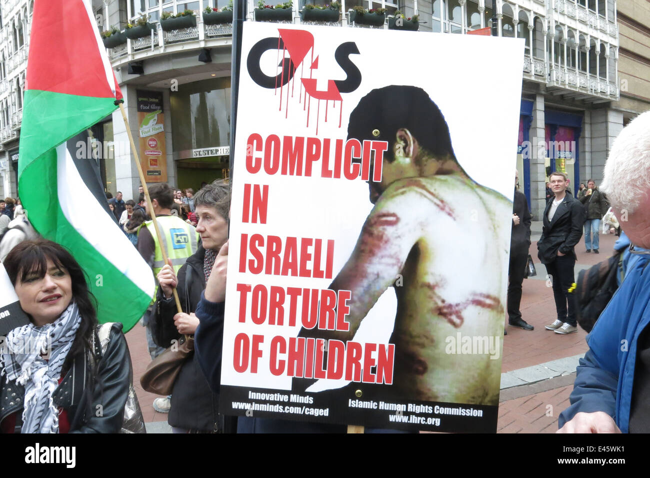 A placard against torture at a protest against G4S private security firm by the Ireland-Palestine Solidarity Campaign (IPSC). Stock Photo