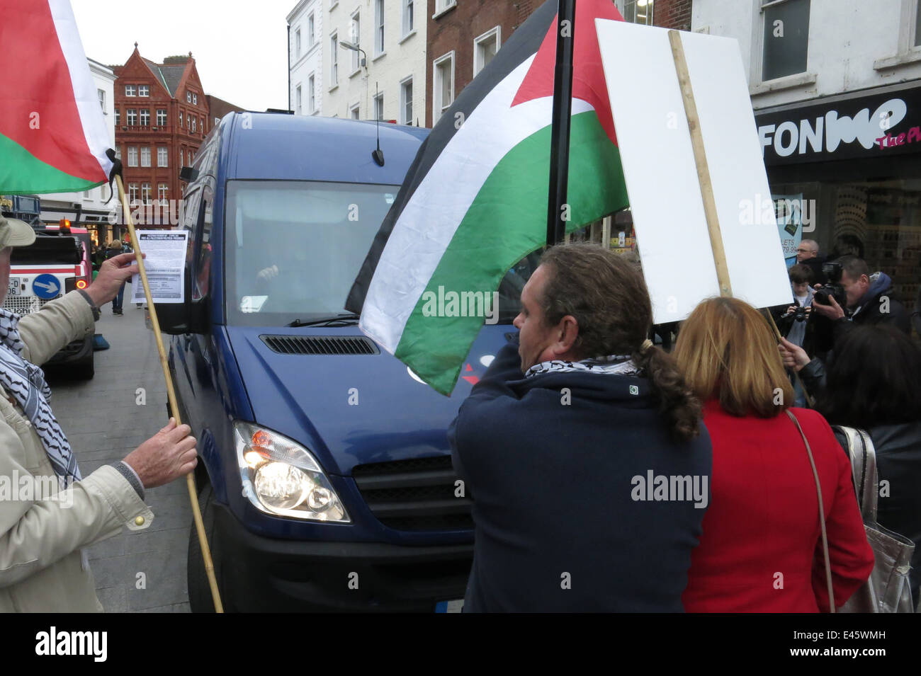 Campaigners block a G4S van at a protest against G4S private security firm by the Ireland-Palestine Solidarity Campaign (IPSC). Stock Photo