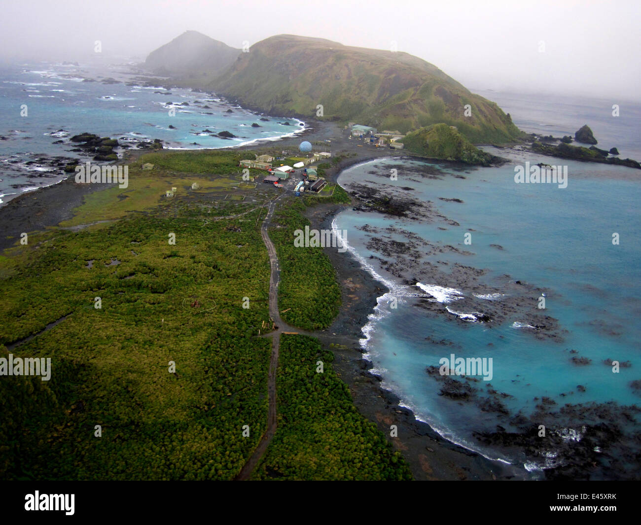 Coastal landscape with research station, Macquarie Island, Southern Atlantic, Australian Antarctica, June 2010 Stock Photo
