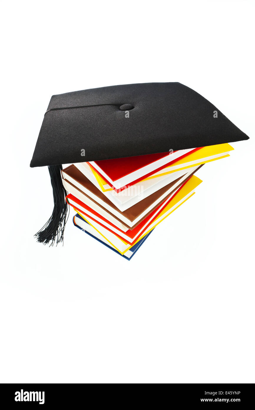 A mortarboard on a book stack on white background. Icon image for costs ...