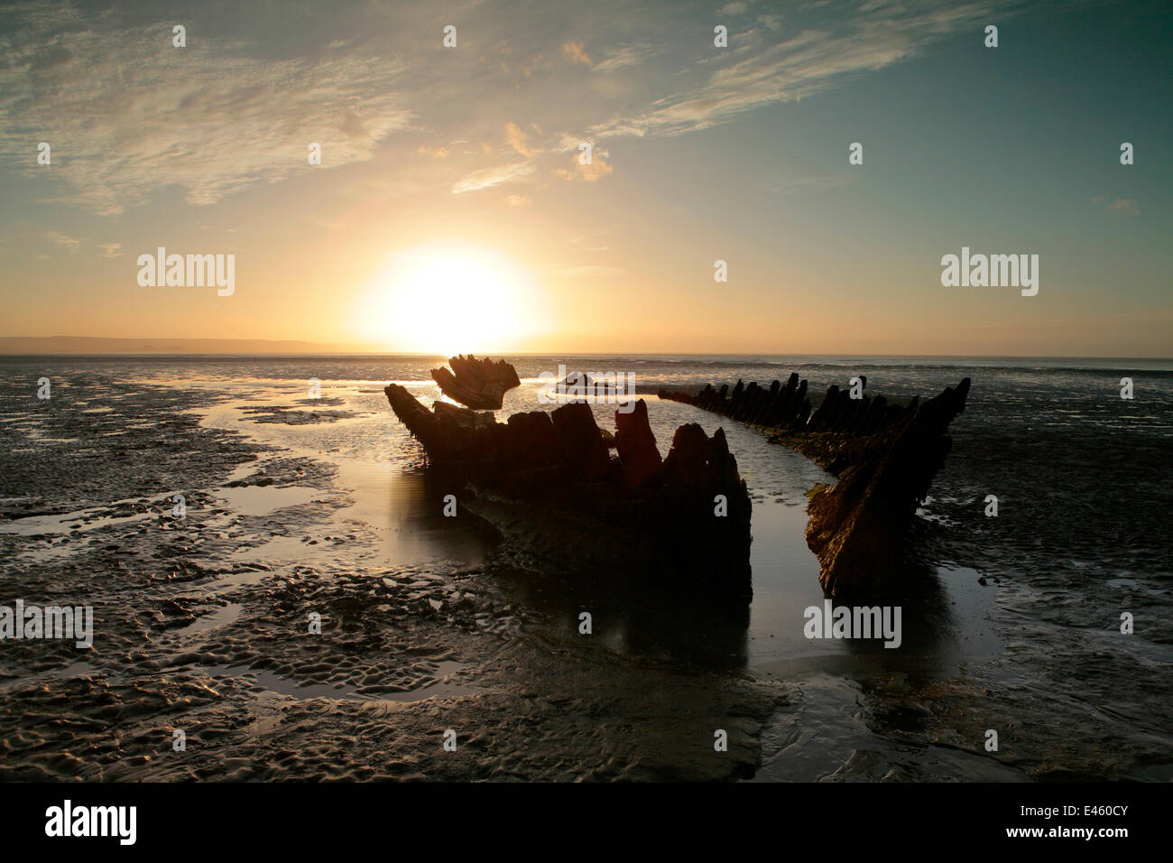 Old wooden hull of ship or barge sunk into the sands at Berrow Flats, Bristol Channel, Somerset, UK. October 2010 Stock Photo