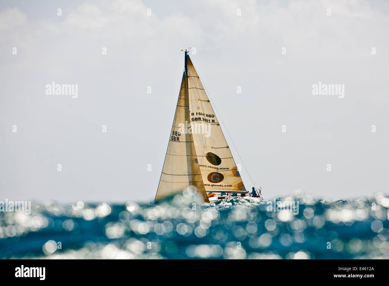 'Lancelot' obscured by glistening wave during the Grenada Sailing Festival, Caribbean, January 2010. Stock Photo