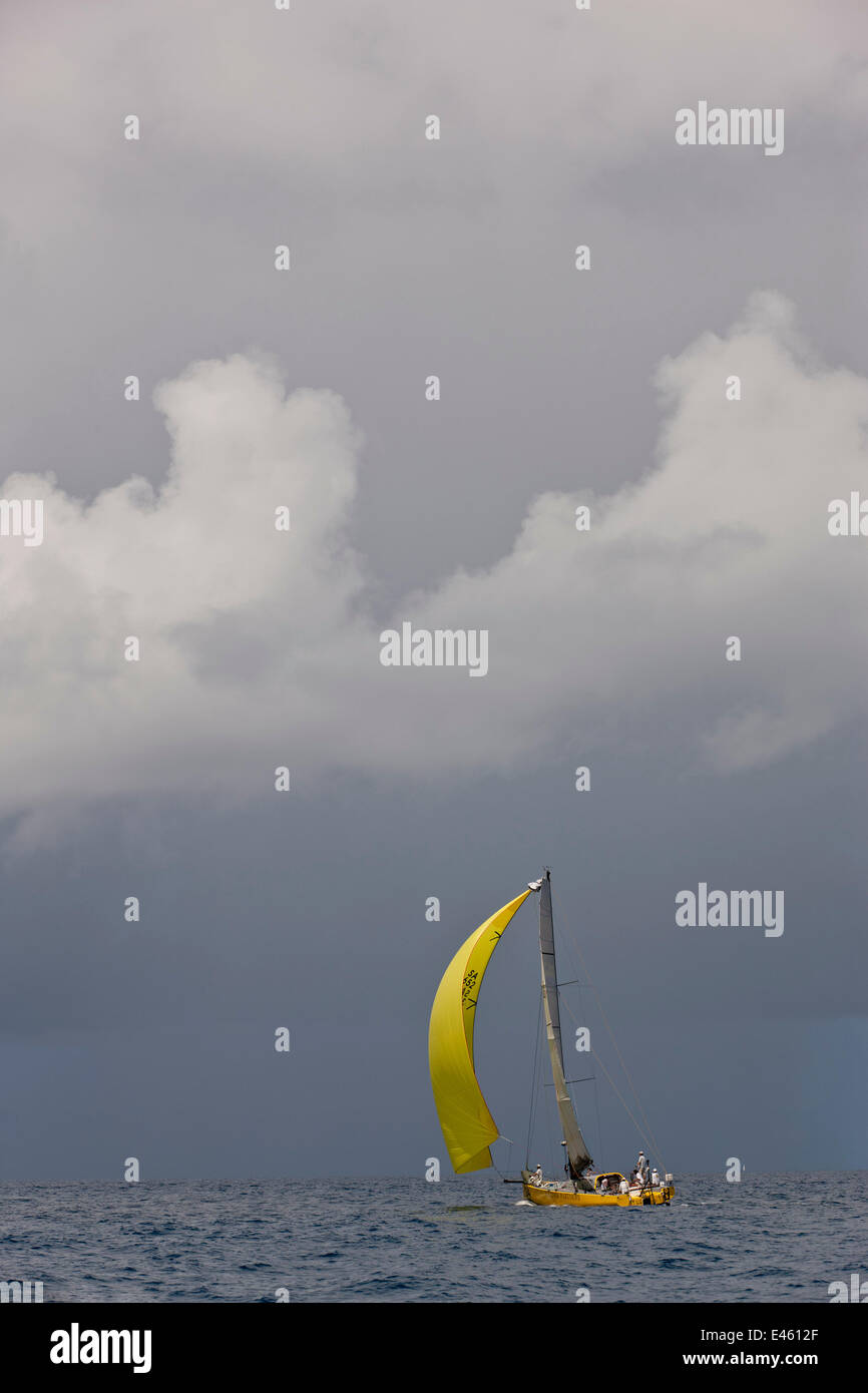 Yacht racing under spinnaker during the Heineken Regatta, St Martin, Caribbean, March 2011. Stock Photo