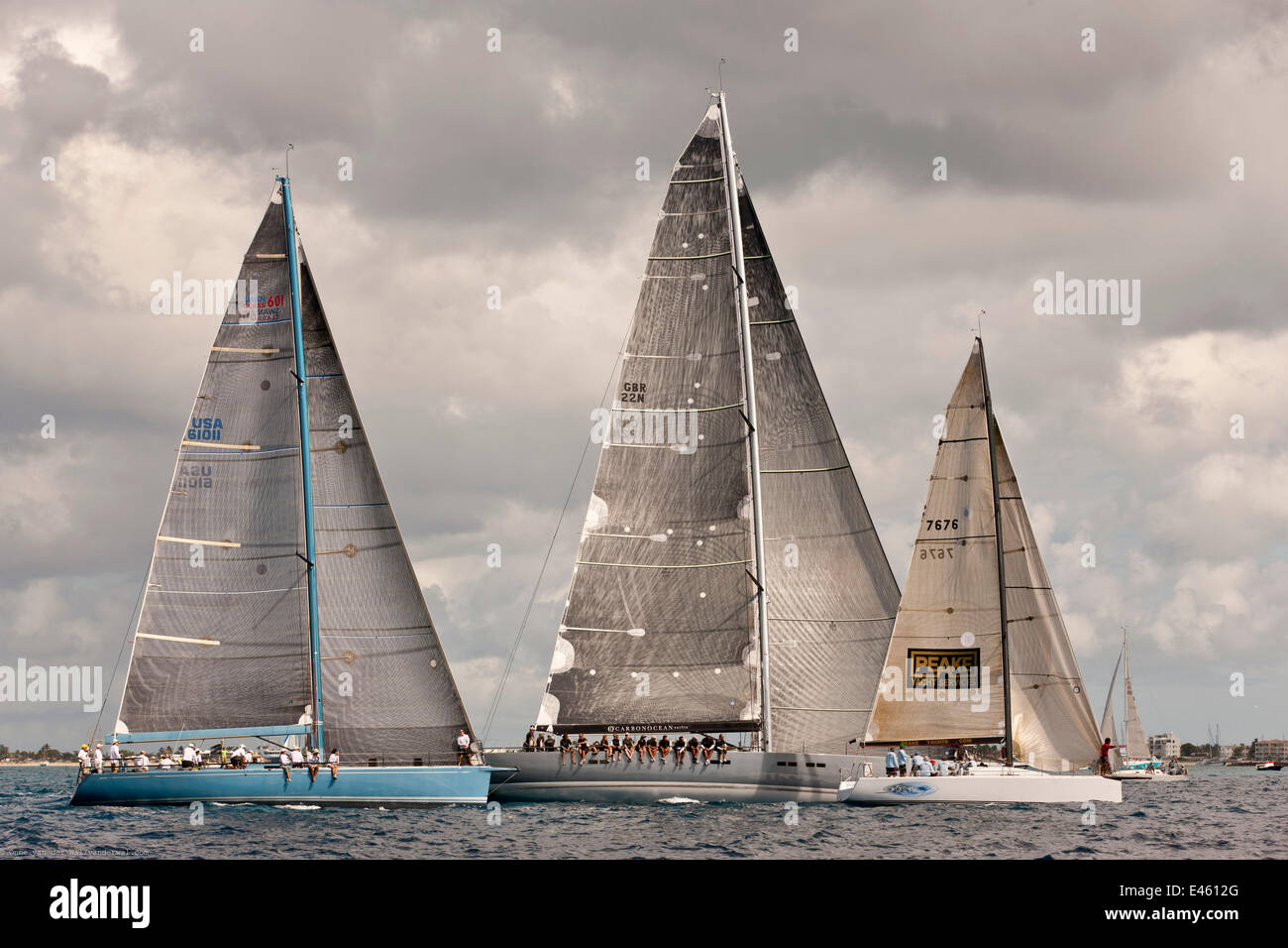 "Aquarius", "Aegir Racing Limited" and "Storm" racing beneath grey skies during the Heineken Regatta, St Martin, Caribbean, March 2011. Stock Photo