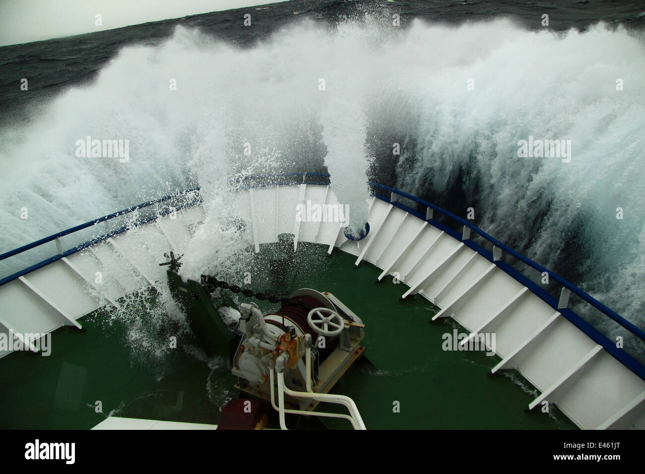 Huge wave hitting the bow of fishing vessel on the North Sea, Europe, April 2011. Property released. Stock Photo