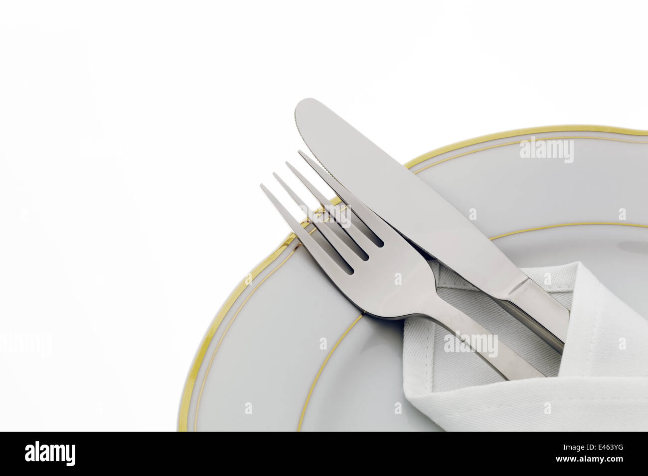 A knife with a fork and plate. Place setting for a dinner at the ...