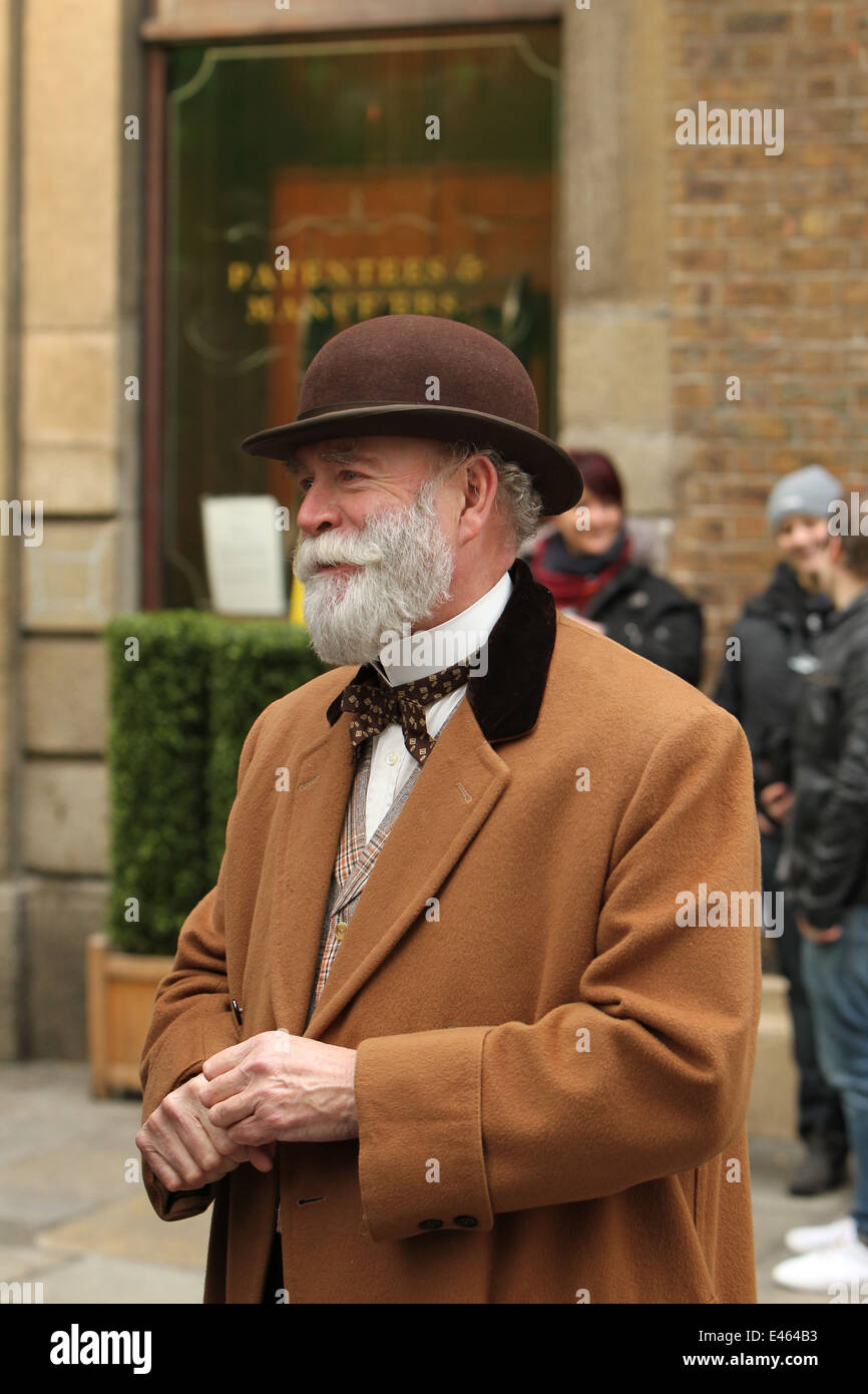 A man dressed up in period costume from the on street set of Victorian horror tv series 'Penny Dreadful'. Stock Photo