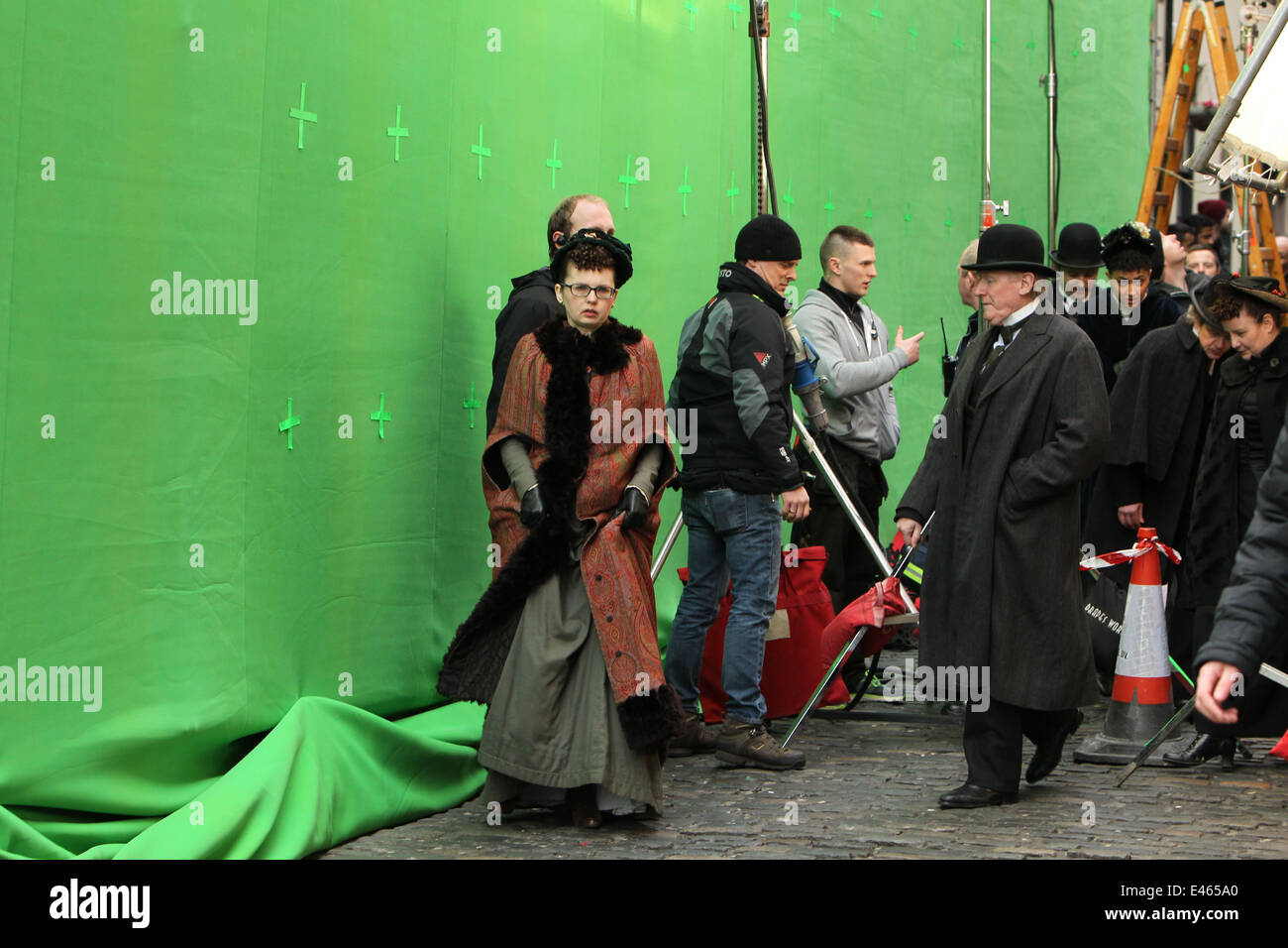 Actors in front of a green screen from the on street set of Victorian horror tv series 'Penny Dreadful'. Stock Photo