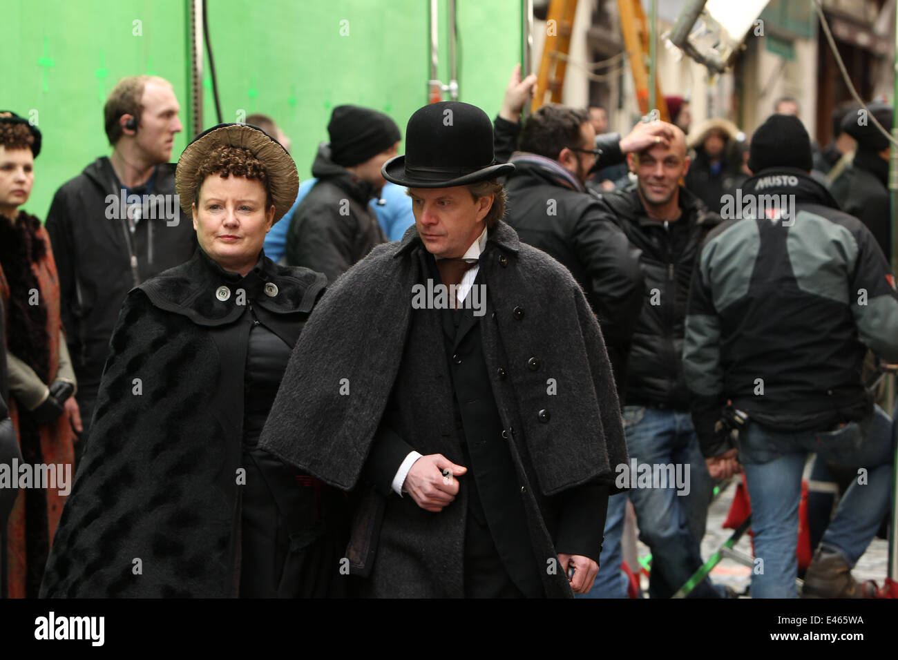 A man and woman dressed up in period costume on the on street set of Victorian horror tv series 'Penny Dreadful'. Stock Photo