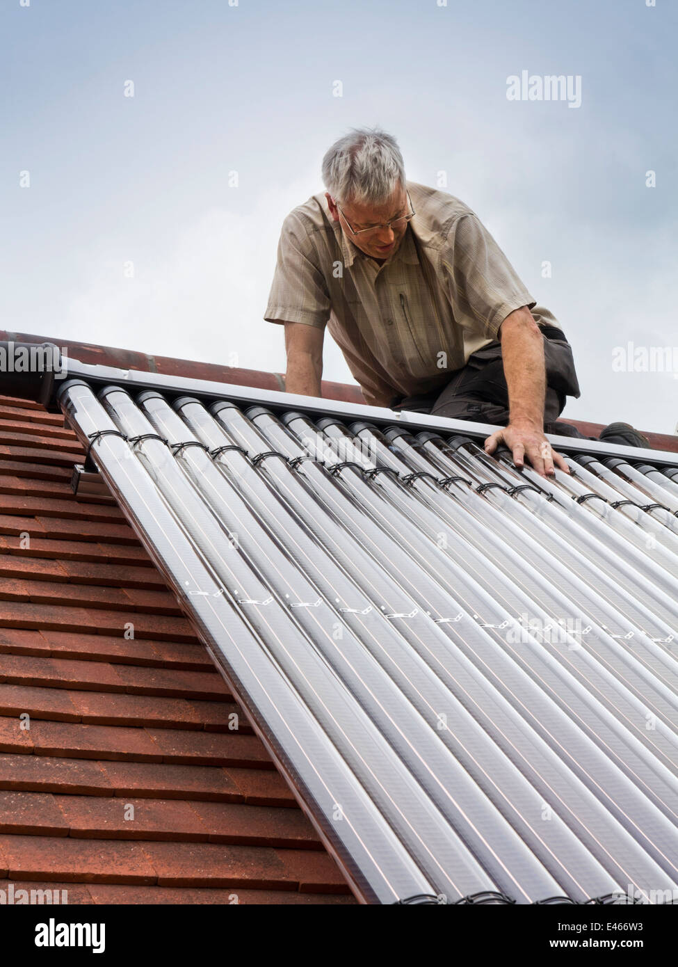 self building house, man fitting Veissmann Solar Thermal Hot Water