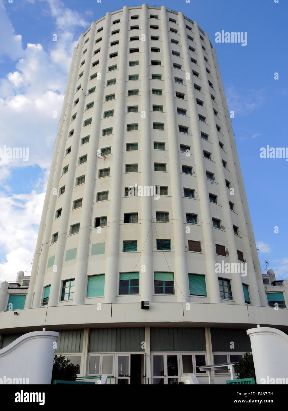 The white tower of the holiday colony 'Colonia marina Edoardo Agnell' of the italian car producer FIAT rises in the blue sky near the ligurian coast of Marina di Massa, on June 18, 2014. Stock Photo