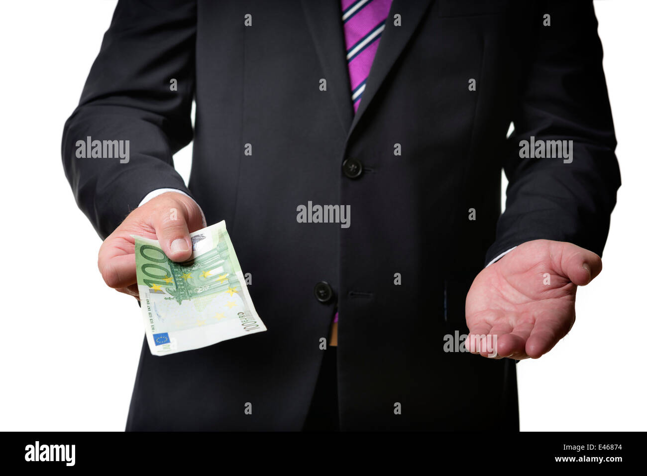 Businessman in dark suit is offering a banknote and holding his hand on Stock Photo