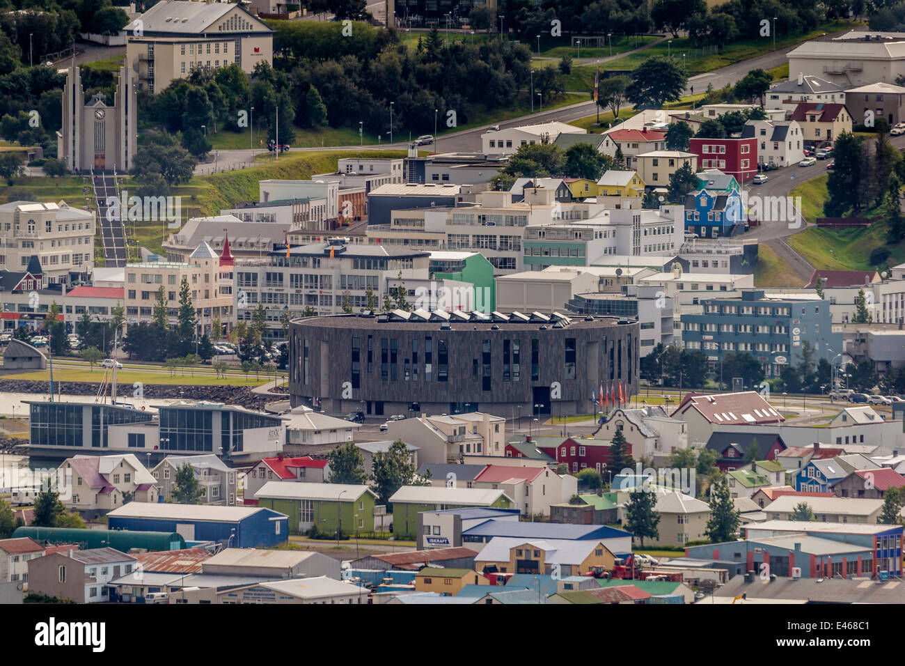 Hof Cultural House surrounded by homes, apartments and shops, Akureyri, Iceland Stock Photo