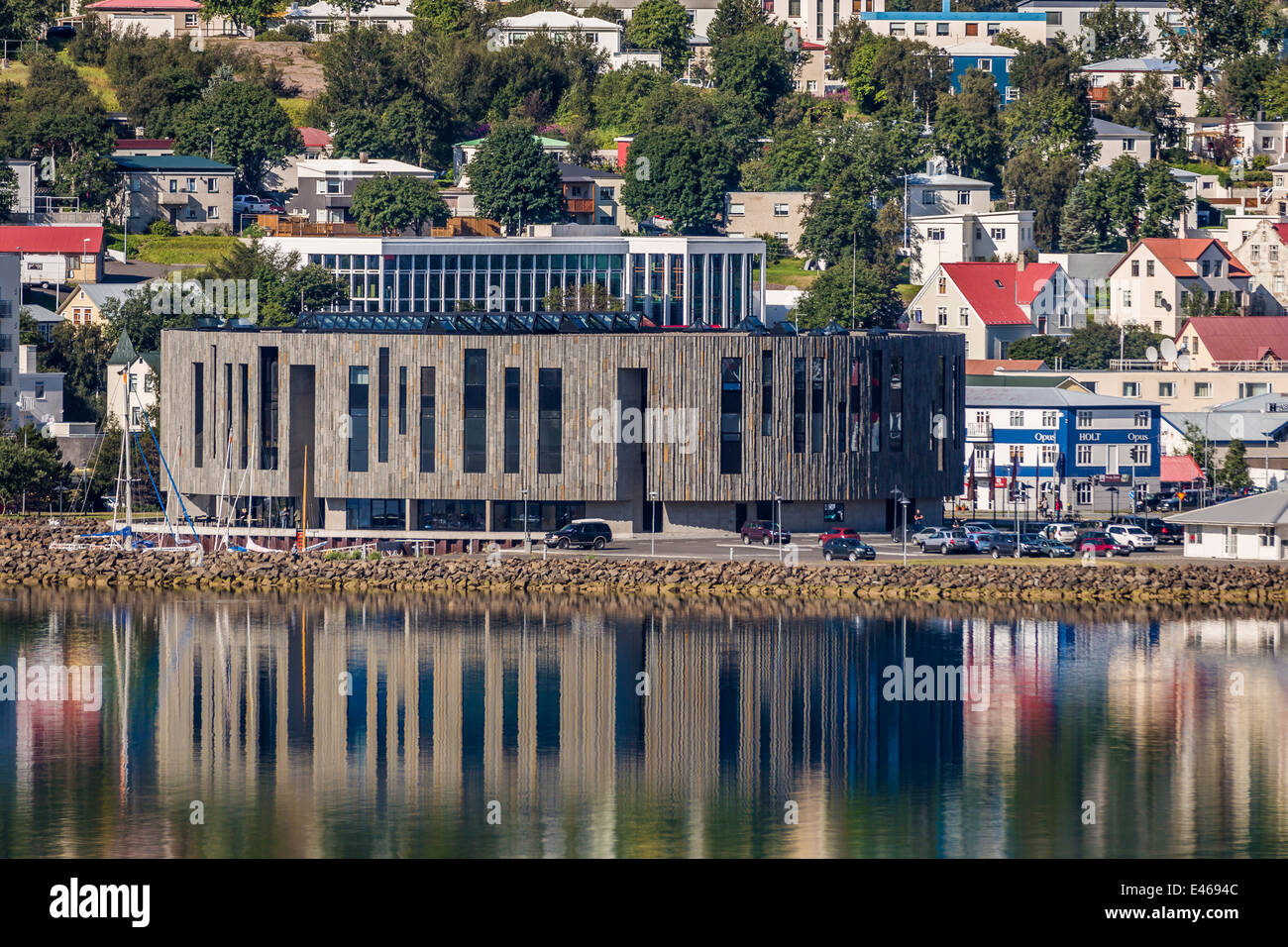 Hof Cultural House surrounded by homes and apartments, Akureyri, Iceland Stock Photo