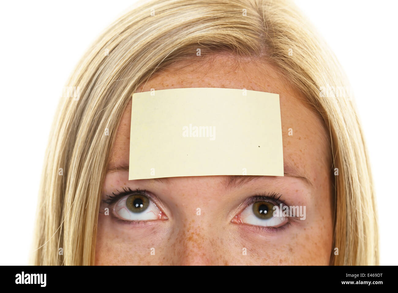 A young woman with a notepad on forehead Stock Photo