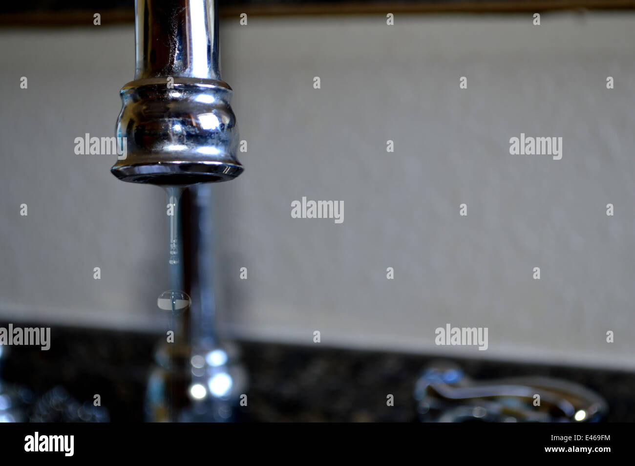 Water dripping from a faucet Stock Photo Alamy