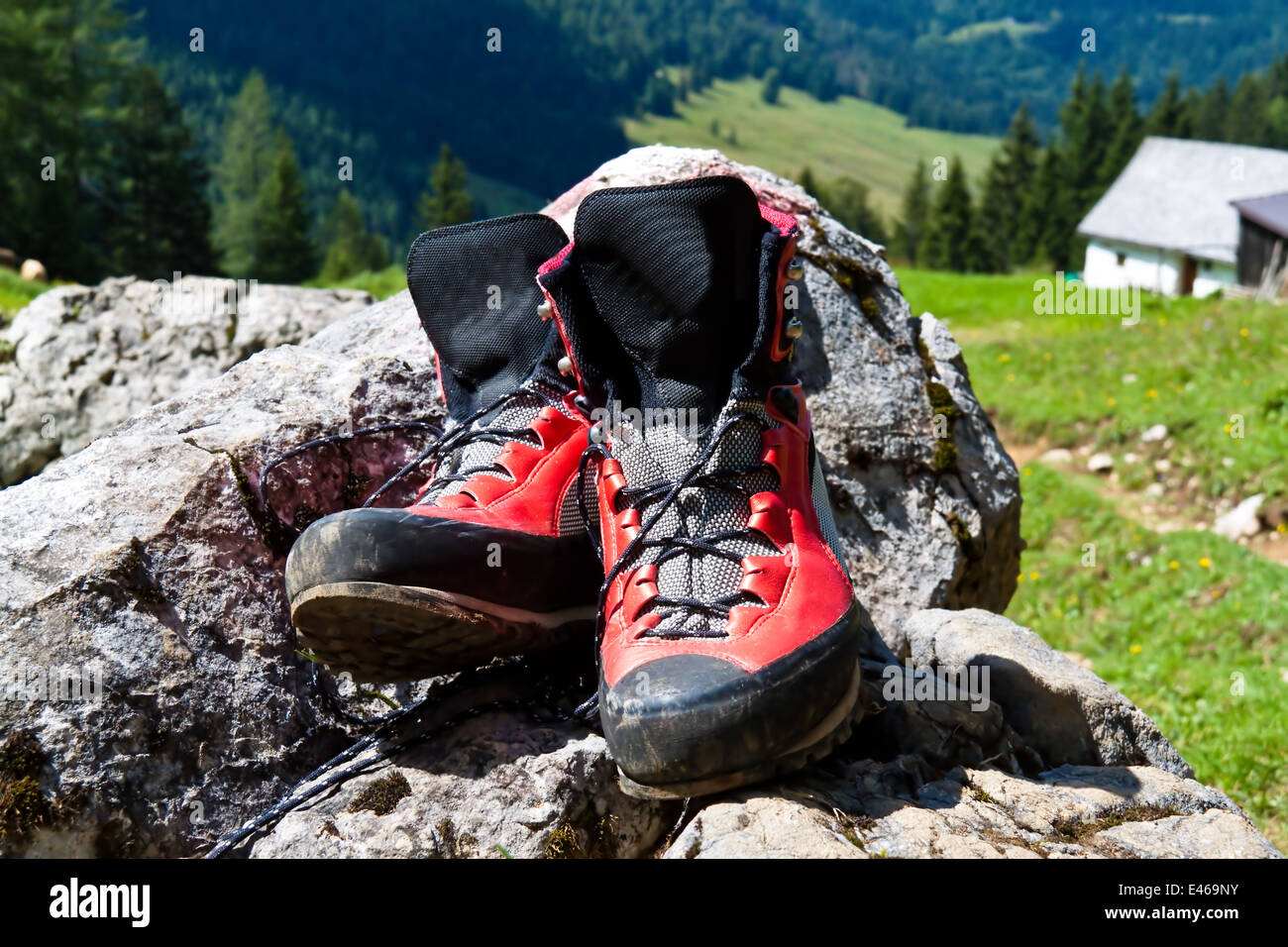Red hiking boots on a hike in the mountains of Austria. Activity during leisure time Stock Photo