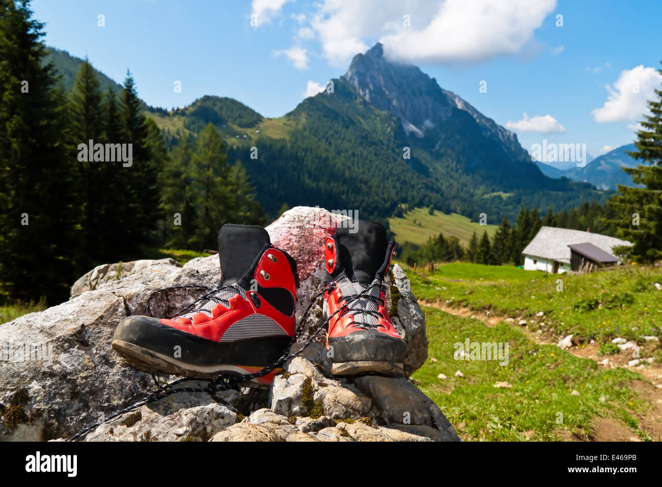 Red hiking boots on a hike in the mountains of Austria. Activity during