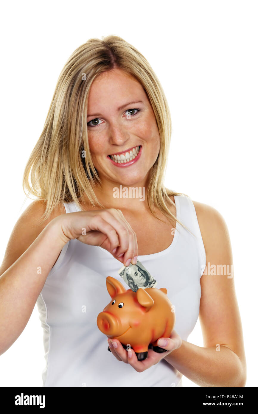 A young woman saves money and coins for the future. Provision and save with dollar bill Stock Photo