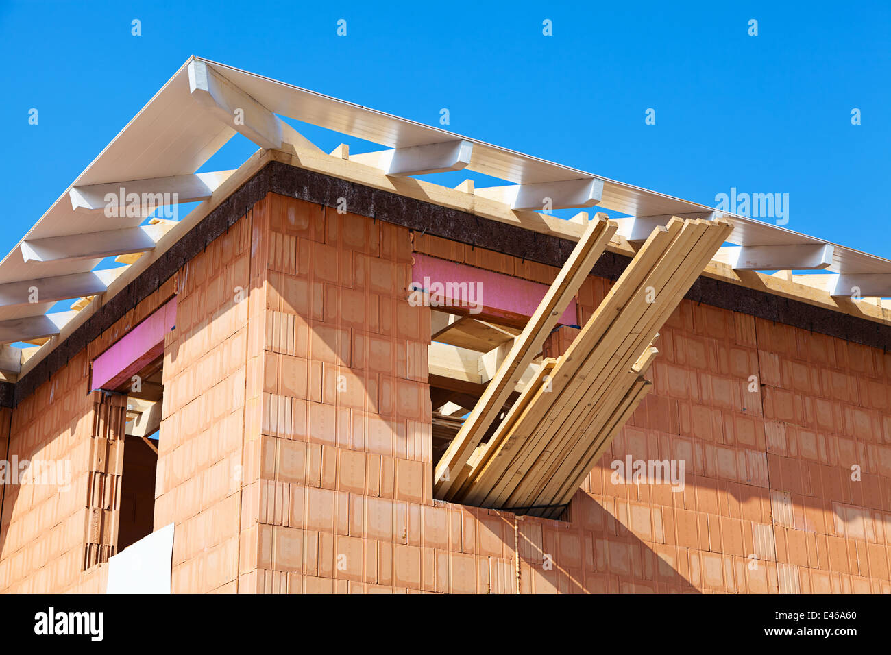 Structural work on a construction site of a residential house. Roof timbering Stock Photo