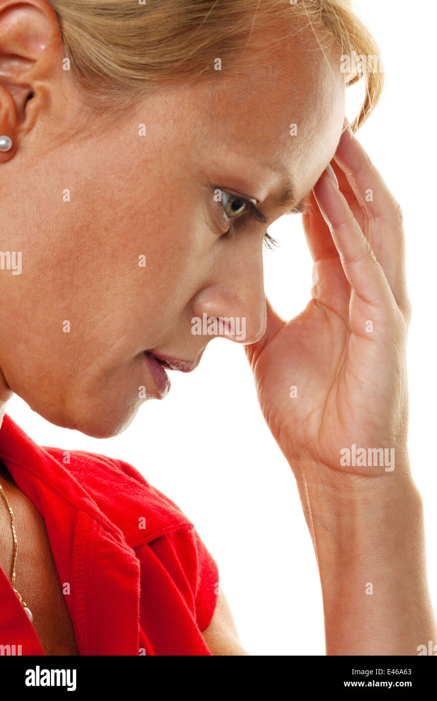 A thoughtful young woman with headaches and migraines. Stock Photo