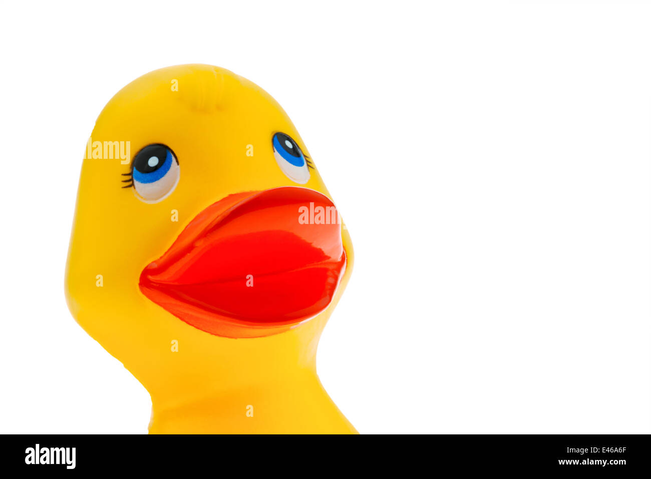 A yellow plastic duck on a white background with a happy face Stock Photo