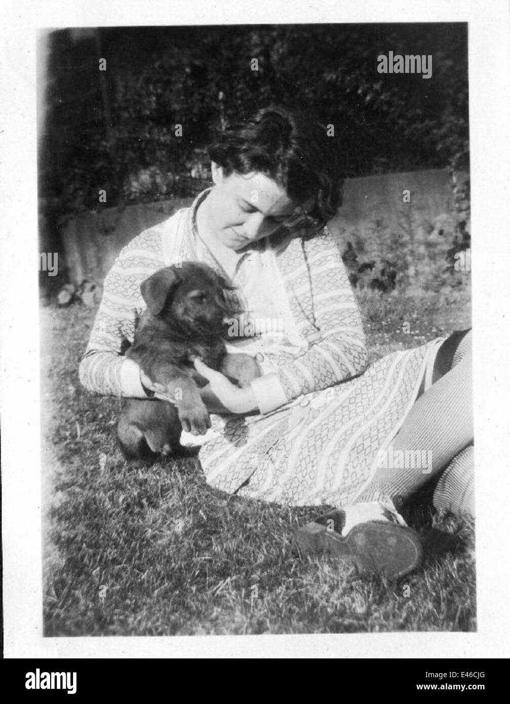 Helen Richey, an early female aviator, is captured with a puppy ...