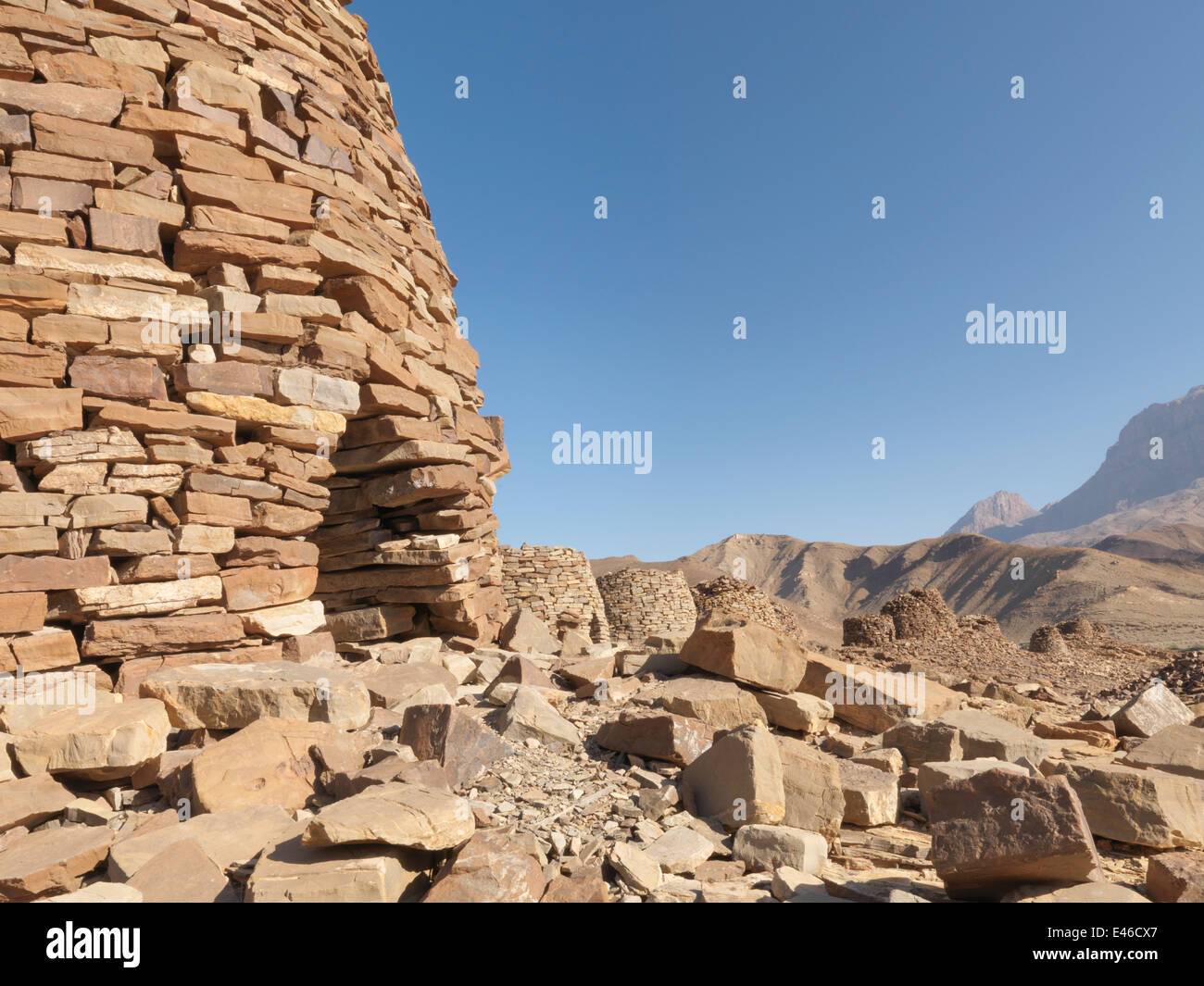 UNESCO World Heritage site in Oman Middle East. Ancient Beehive tombs on a ridge top in the Hajjar mountains near Al-Ayn. Stock Photo