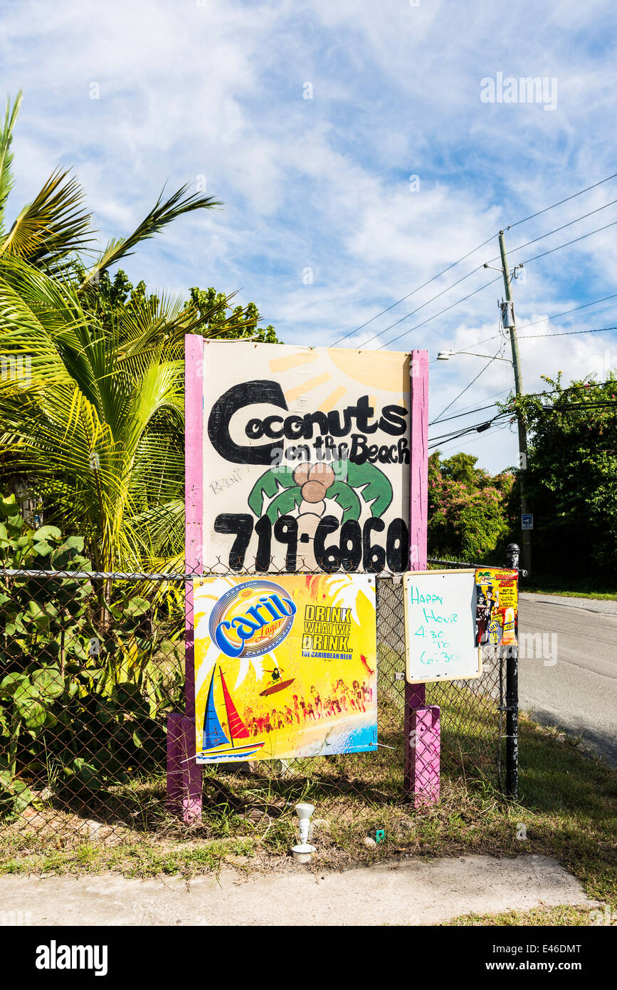 A sign advertising "Coconut Beach" a beachside eatery in Frederiksted