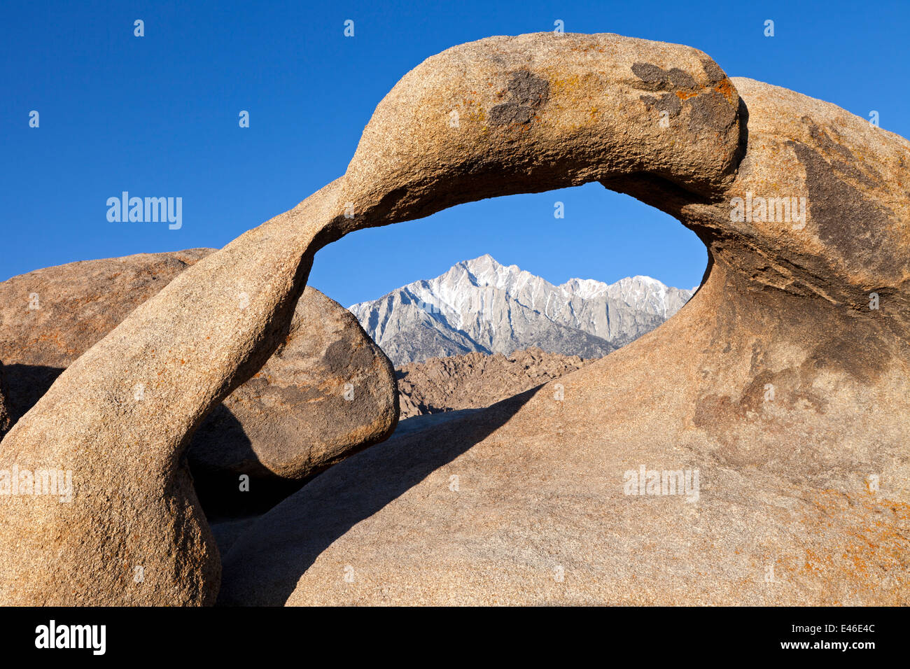 Mobius Arch, in California's Alabama Hills State Recreation Area forms a portal to view Lone Pine Peak. Stock Photo
