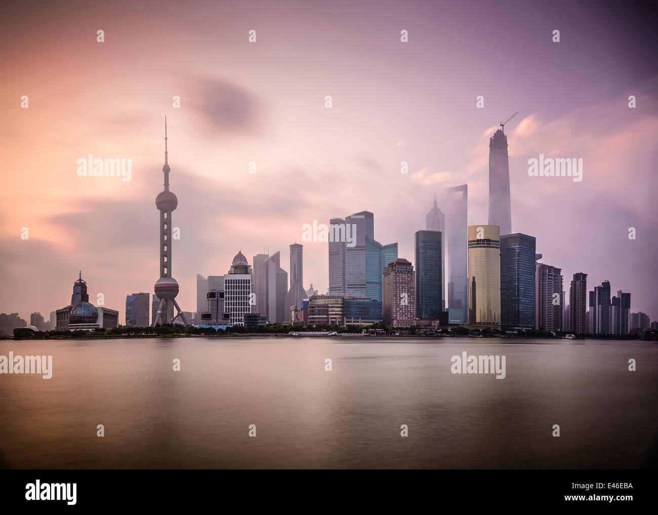 Shanghai, China cityscape viewed across the Huanpu River at dawn. Stock Photo