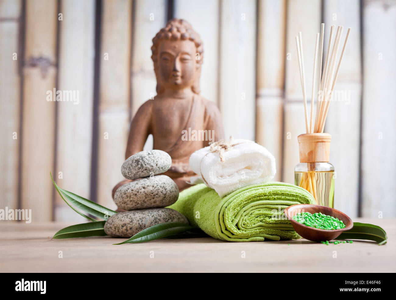 buddha statue and spa items in sauna, relaxation background Stock Photo
