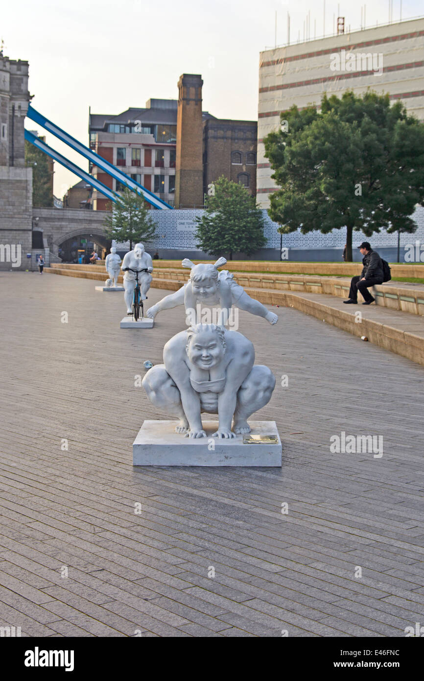 Stone figure sculptures on Queens Walk by City Hall London Stock Photo