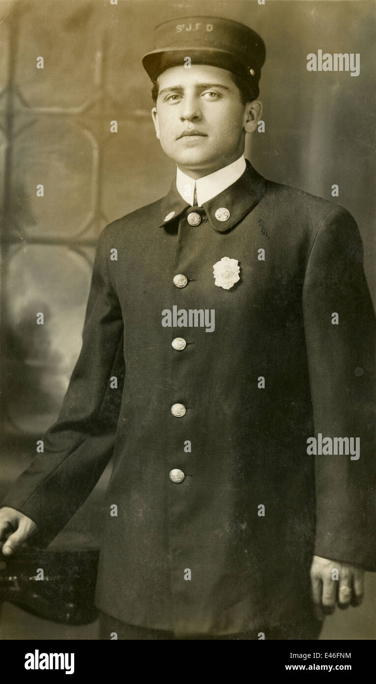 Antique photograph, circa 1910 image of a fireman from the St.J.F.D., possibly Saint John, New Brunswick, Canada. Stock Photo