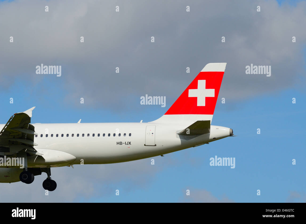 Tail fin of Swissair Airbus 320 landing at Heathrow Stock Photo
