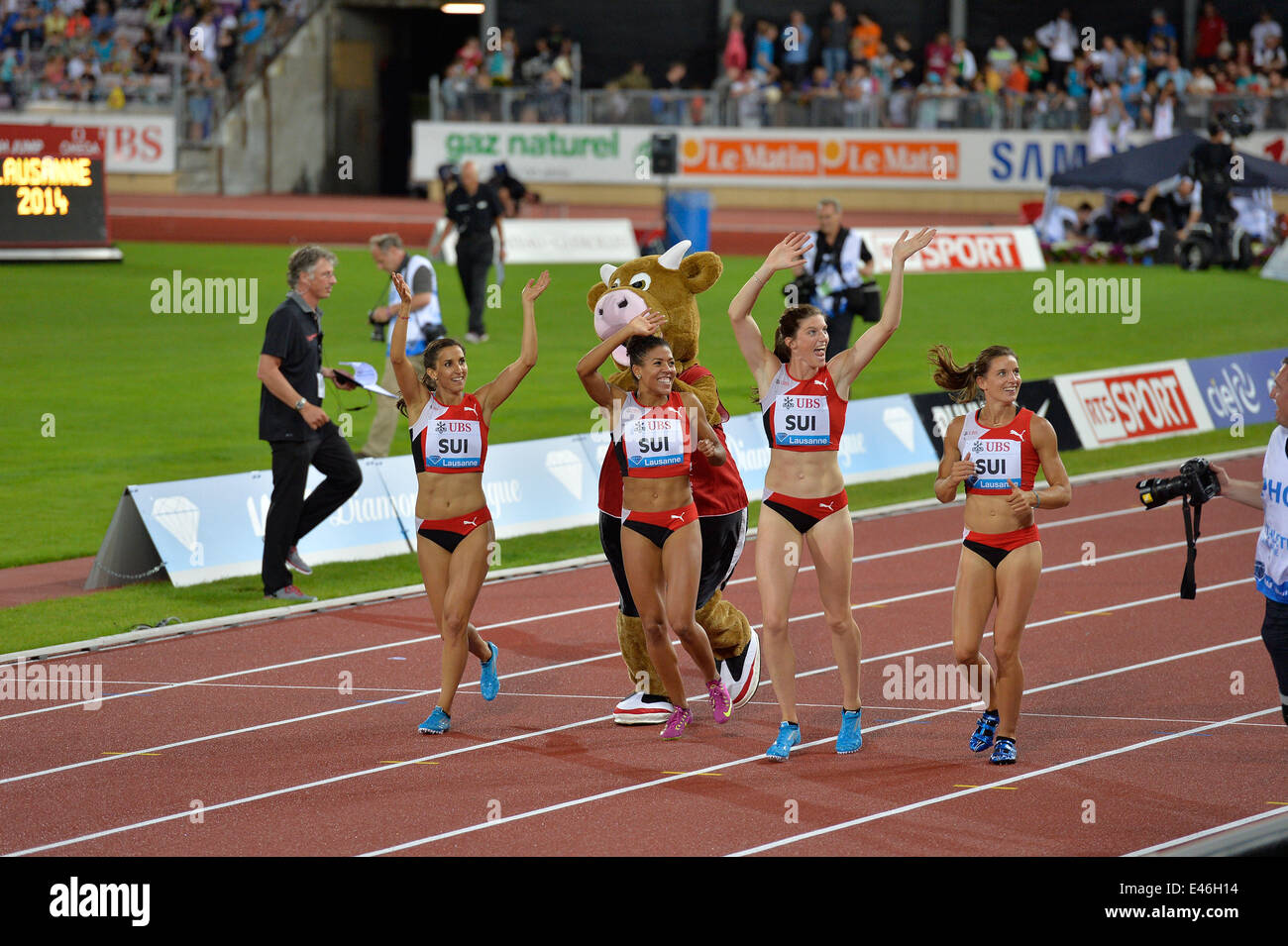 Lausanne Switzerland. 3rd July, 2014. Members of the Swiss (SUI) women's 4x100m relay team celebrate after setting a National record at Diamond League Lausanne - Athletissima 2014.  Credit:  Ted Byrne/Alamy Live News Stock Photo