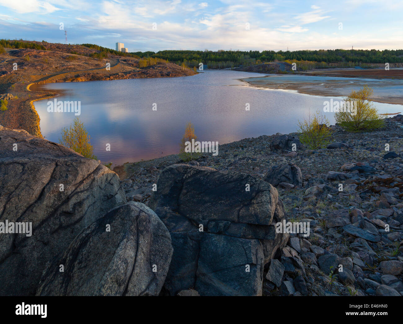 Large rocks on a hillside overlooking a tailings pond in Sudbury near the Vale Mining operations. Sudbury, Ontario, Canada. Stock Photo