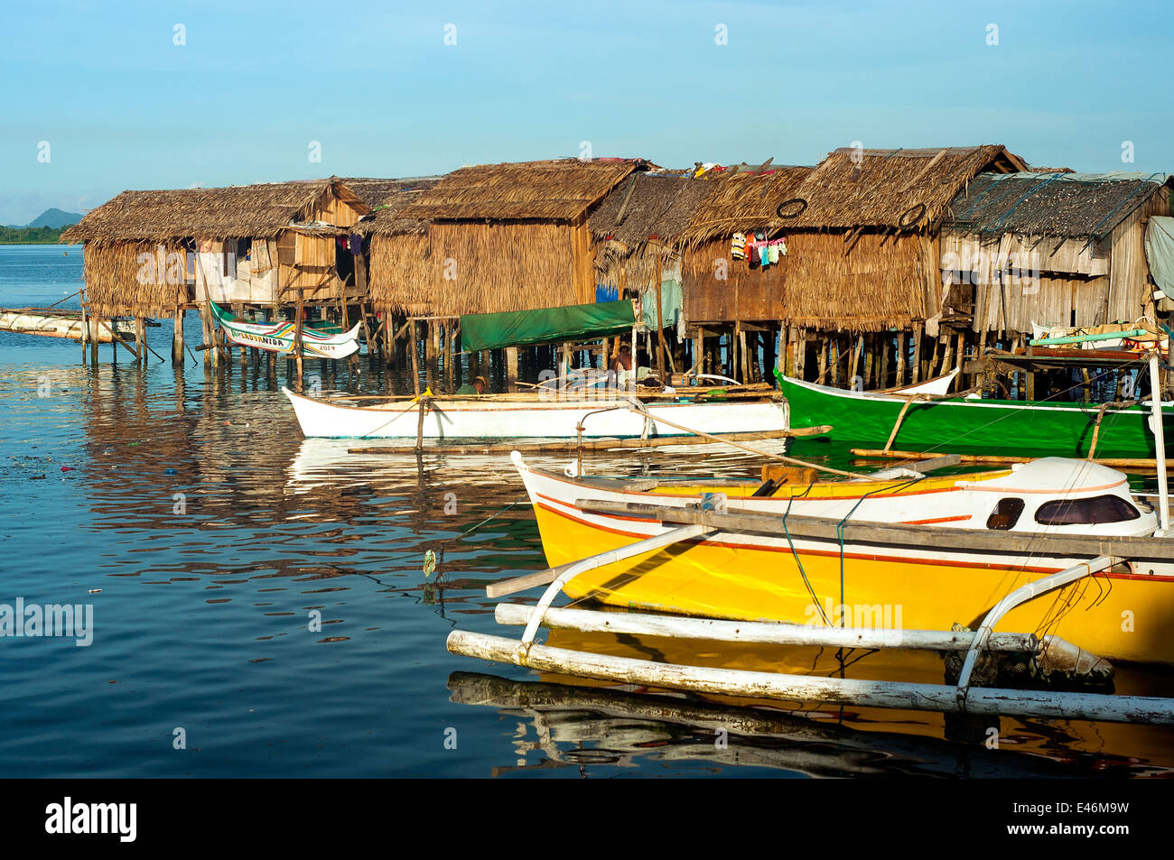 Port area with outrigger boats and stilt nipa houses, Surigao, Mindanao, Philippines Stock Photo