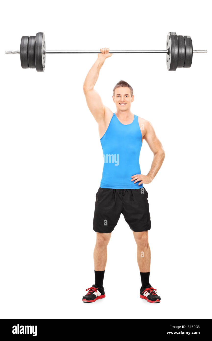 Full length portrait of a strong guy holding a barbell in one hand isolated on white background Stock Photo