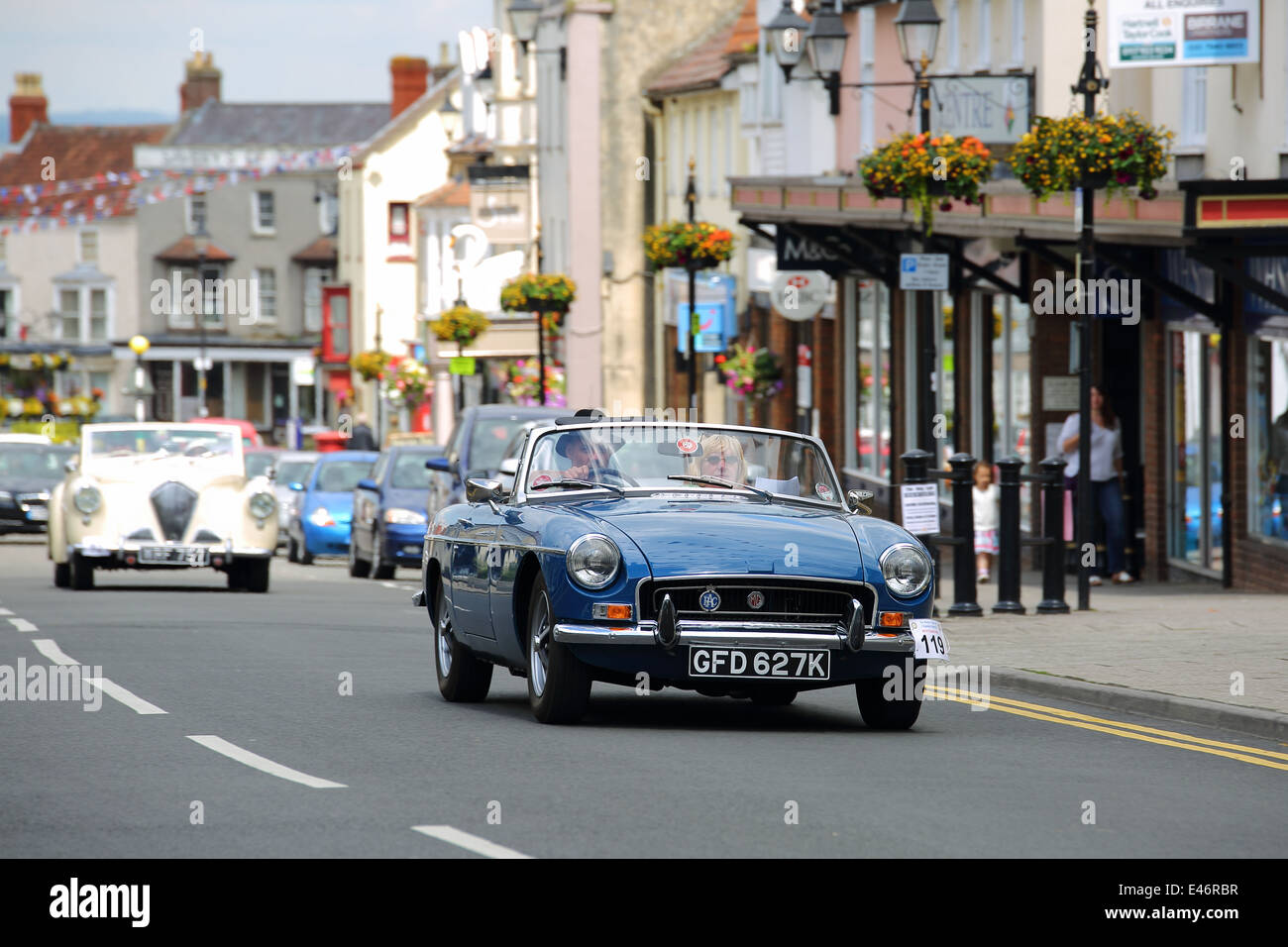 Classic Cars and Bikes driving through Thornbury Town taking part in